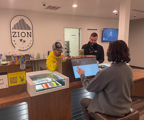 Zion Medicinal cannabis pharmacy staff assisting patient